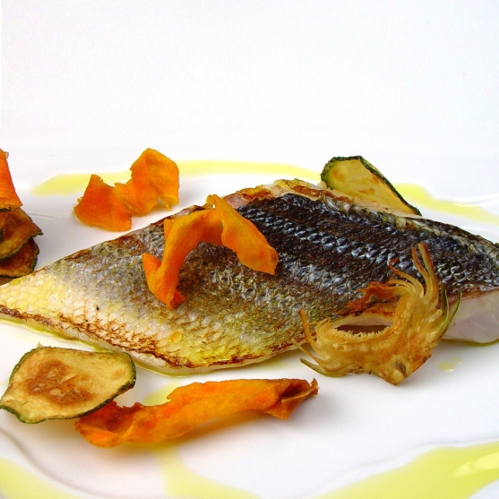 Bea bass with sweet potato, courgette and artichoke chips
