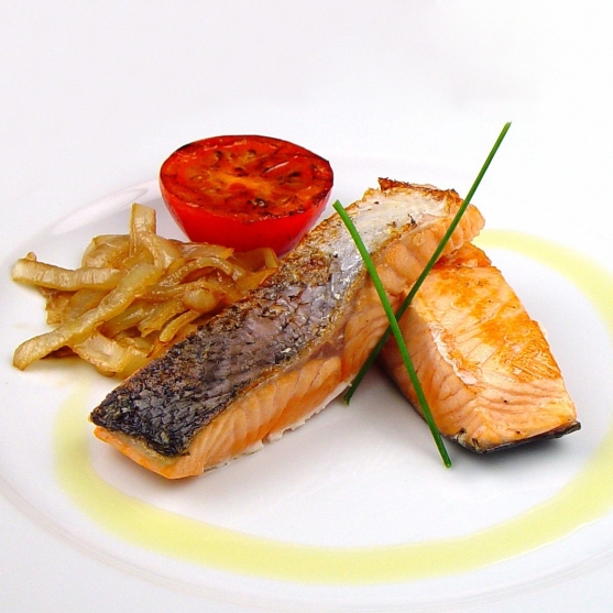 Grilled salmon with fried onion and tomato